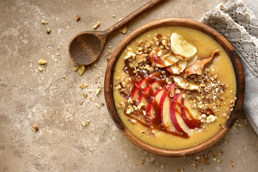 Bowl Of Apple Banana Smoothie With Granola, Caramel And Peanut Butter (apple Pie).top View With Copy