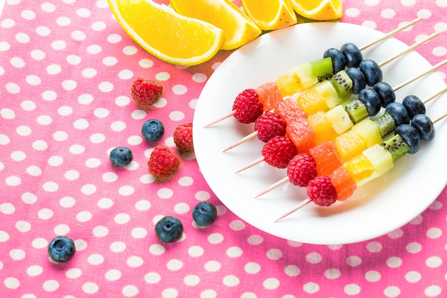 Fresh Fruits On Skewers In Plate On Table, Closeup